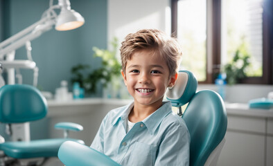 Fototapeta premium Happy boy sitting in the dental chair