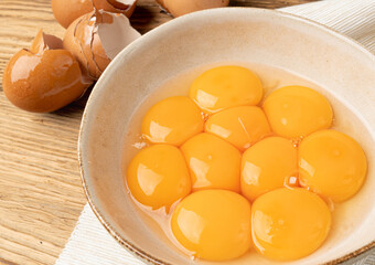 Egg Yolks in Bowl, Fresh Chicken Egg Yolk Separated from Whites for Cooking Recipe, Organic Yolks Top View