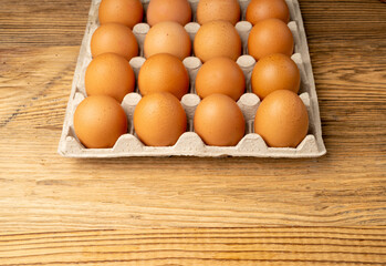 Egg Tray on Wooden Rustic Background, Twenty Brown Eggs Pack