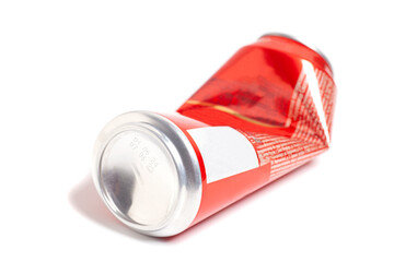 Empty crumpled red can from energy drink or beer