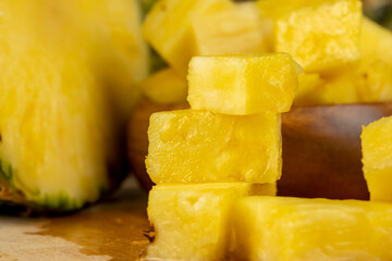 sliced ripe yellow pineapple, a large number of pieces