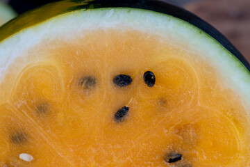ripe orange watermelon with black pits watermelon close-up