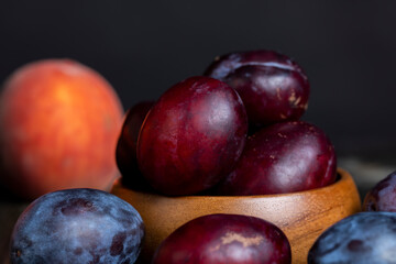 Ripe plums on the table in the kitchen