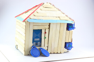 RFID system installed on the model house door controlled by micro servo and micro controller shows...