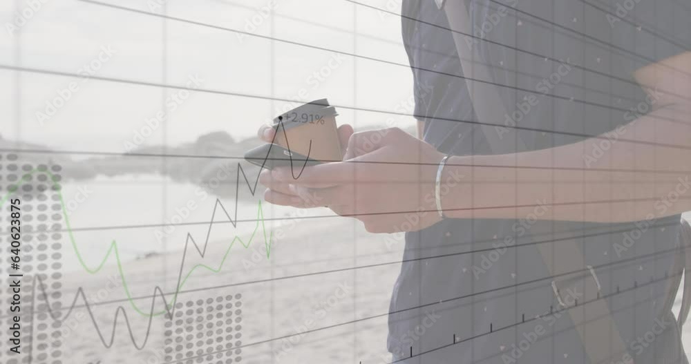 Aufkleber animation of statistical data processing over mid section of a man using smartphone near the sea