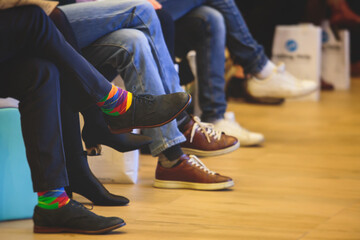 Speakers shoes at the business conference event, audience at the lecture hall listens to lecturer,...