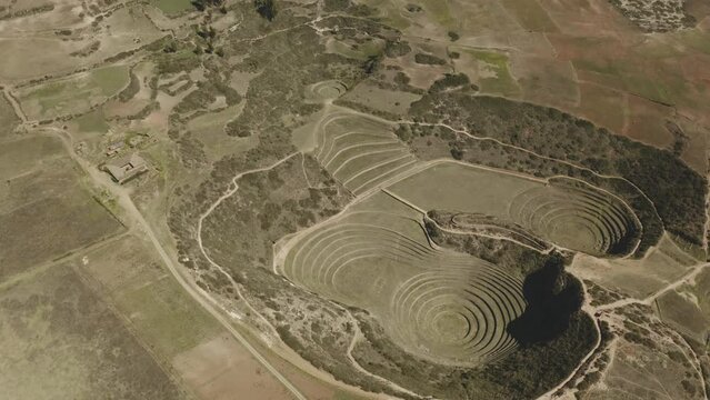 Aerial view of Moray Archeological site. Inca ruins of several terraced circular depressions, in Maras, Cusco province, Peru.