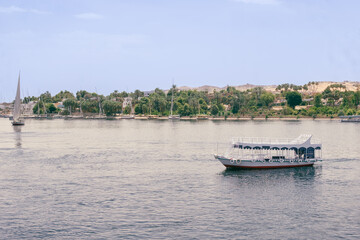 Fototapeta premium Egypt Summer Travel Riverside Tranquility: Small Boats by Luxor's Nile Banks