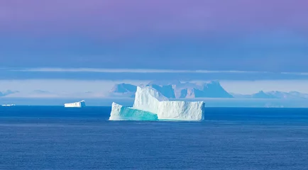 Fototapeten Iceberg seen from cruise ship vacation near Greenland coast in Arctic circle near Ilulissat Disko Bay. © eskystudio