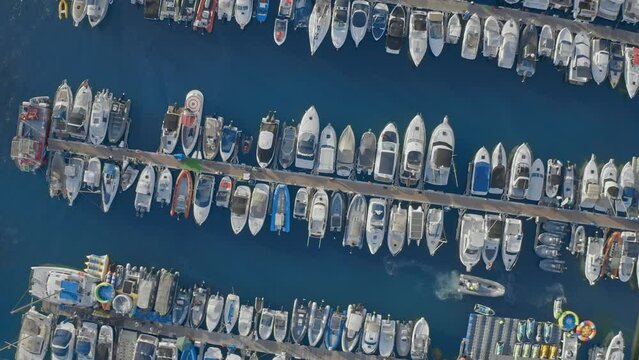 Aerial of boats and yachts docked in marina harbor. Tenerife, Canary, Spain
