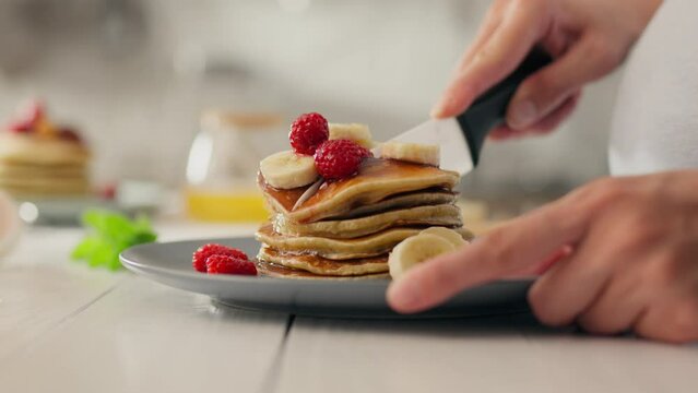 Cooked, the housewife deep-cooks desserts and sweet treats, in the home kitchen. expectant mother is cooking pancakes for breakfast, uses a new recipe for morning breakfast, dough