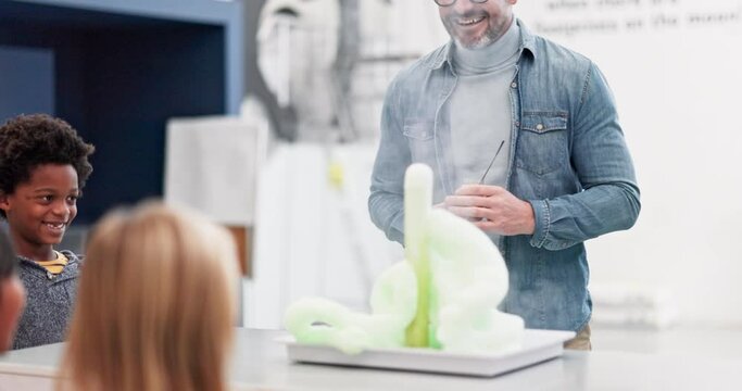 Chemistry, teacher and experiment in science classroom with excited children learning about chemical, explosion or reaction. Happy, kids and foam shoot from beaker in school, class or education