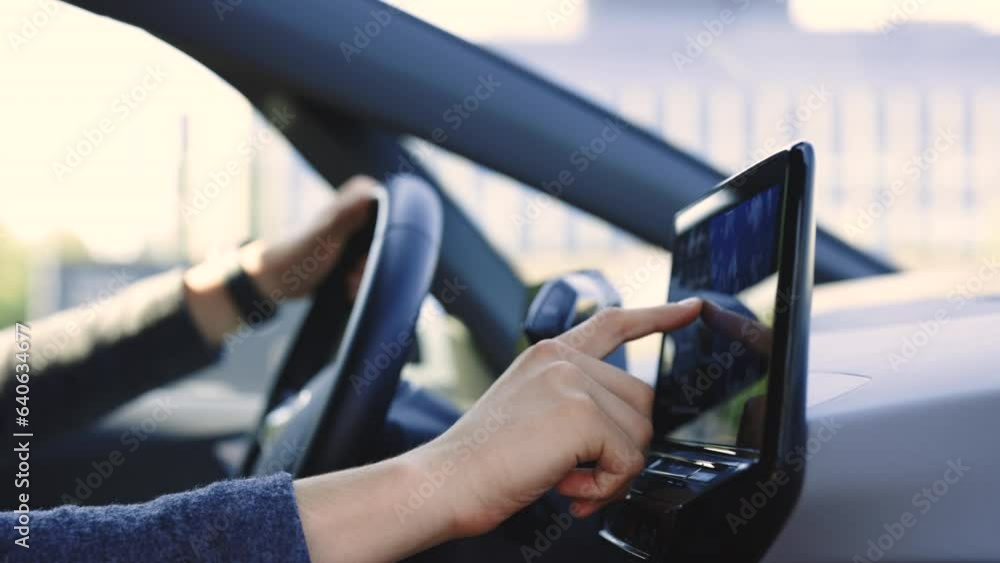 Wall mural unrecognizable man which typing needed coordinates on navigator touchscreen inside his auto. unknown