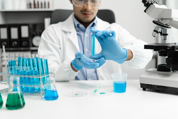 Male biotechnologist testing new chemical substances in a laboratory.