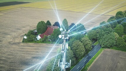 Communications tower sends individual network lines of data and 5G, 6G connections to access points in rural landscape - Powered by Adobe