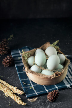 fresh duck eggs on bamboo basket and sackcloth with dark and texture background. Duck Egg Yolk salted