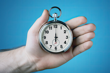 Hand holding a timer, Concept of Strategic competition in business or marketing. urgency and deadlines in business.