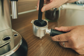 Fototapeta na wymiar Preparing an espresso in the morning at home