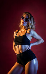 Obraz premium photo of beautiful woman with red and pink lighting and backdrop , generative AI