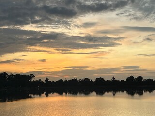 Sunrise seen from an artificial pond built for the king's ablution, Srah Srang, Angkor ruins, Siem Reap, Cambodia