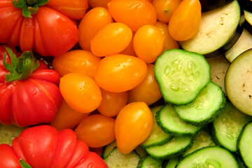Mixed fresh vegetable background. Healthy eating ingredients. Slice of mix veggies, tomatoes, cucumbers, cherry tomato, eggplant. Nutrition, diet, vegan food. Assorted fruits rotating view closeup 4K