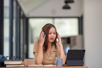 Asian female college students learn from remote online classes. Learn to make video calls online.