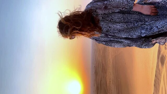 Beautiful woman in the desert during sunset. High quality FullHD footage