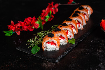 Various Sushi, rolls on a dark background