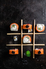 Various Sushi, rolls on a dark background