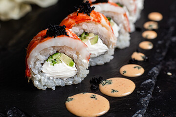 Various Sushi, rolls on a dark background