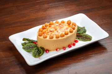 Chickpea hummus with smoked paprika. Isolated on a dark background