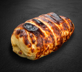 Grilled suluguni cheese on a dark stone background. BBQ menu