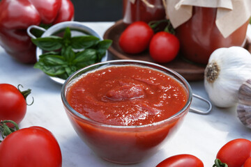 Italian tomato sauce with basil, onion, pepper and garlic. Close-up. Side view.