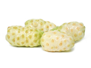 Fresh noni laying on white background.