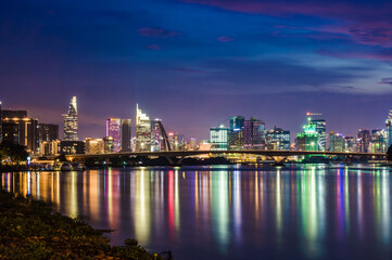 Ho Chi Minh City skyline and the Saigon River at sunset.  It is a popular tourist destination of Vietnam.