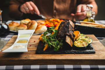 Beef rib with vegetables in a restaurant.