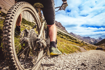 Close up of a mountain bike wheel and derailleur. Bike trip in the mountains. - 640676201