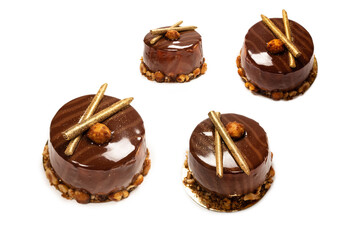 Chocolate and caramel cake isolated on a white background.