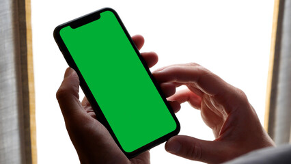 Holding a Green Screen Smartphone, Home Background