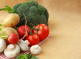 Obraz na płótnie Canvas fresh organic vegetables - broccoli, tomatoes, mushrooms