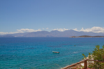 Fototapeta na wymiar View of the turquoise mediterranean sea with mountains at the island of Crete, Greece, near Agios Nikolaos