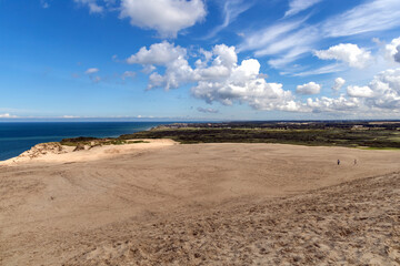 Fototapeta premium Sand dunes and seascape next to Rubjerg Knude Lighthouse.