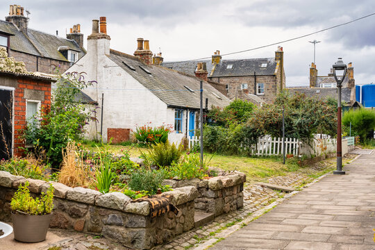 Fishing district with typical houses of ancient times in the city of Aberdeen, Footdee, Scotland.