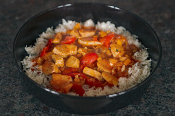ready to eat - sliced and grilled chicken in a curry sauce with rice 