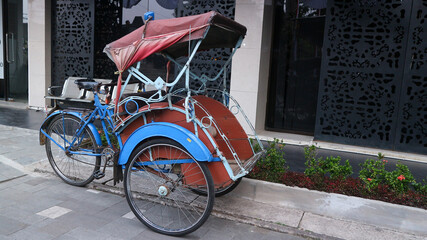 Becak, rickshaw is a traditional vehicle in Indonesia.