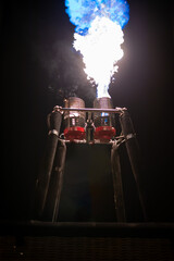 close up of hot air balloon show burner flame glowing at a night