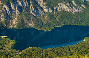 Aerial landscape view of Bohinj Lake near mountain range in Triglav National Park, Slovenia. Landscape during the autumn season. Travel and tourism concept