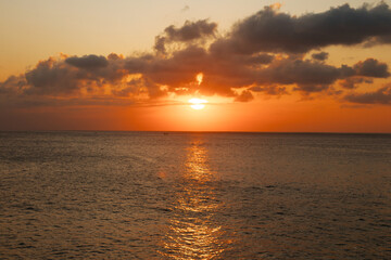 Warm sunset against the backdrop of the Indian Ocean. Beautiful natural background
