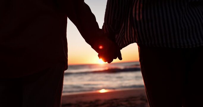 Holding hands, beach and couple at sunset with silhouette and peace on vacation and travel. Sea, ocean and tropical adventure with people together with love, support and marriage care on holiday