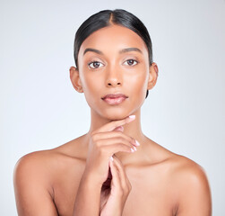 Studio portrait of Indian woman for skincare, beauty and cosmetics on white background for salon...